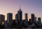 Australian skyline at sunset, hinting at wealth.