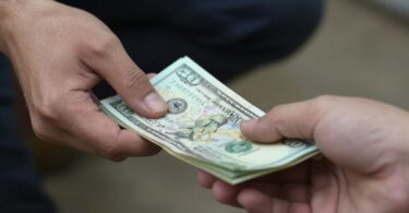 Money being exchanged, unconventional earning methods.