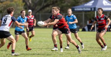 Balmain Touch Football players in action on a sunny field.