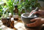 Person learning homeopathy with herbs and natural remedies.