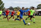 Dianella Soccer Club players in action on a green field.