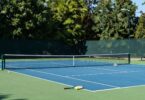 Tennis court at Discovery Park Tennis Club, rackets and balls.