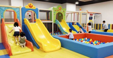 Kids playing in a colourful indoor playground.