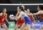 Netball players in action on the court.